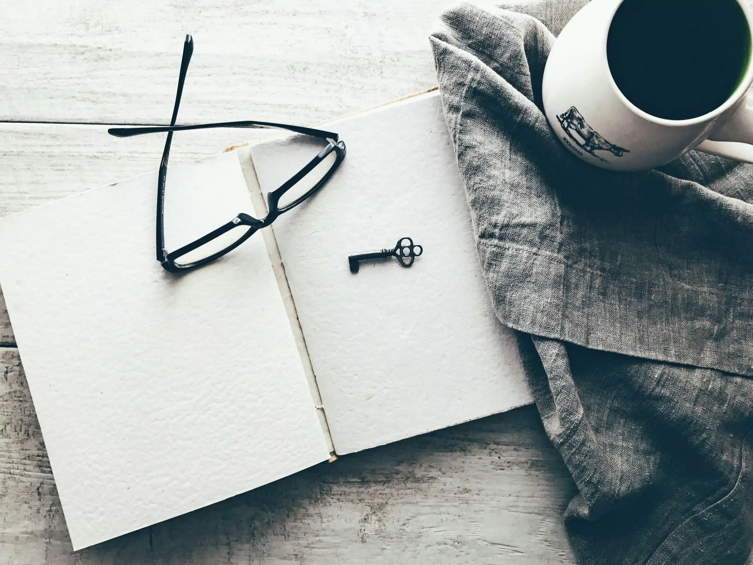 Everything You Need to Know About Windows 10 Product Keys 1 eyeglasses and skeleton key on white book